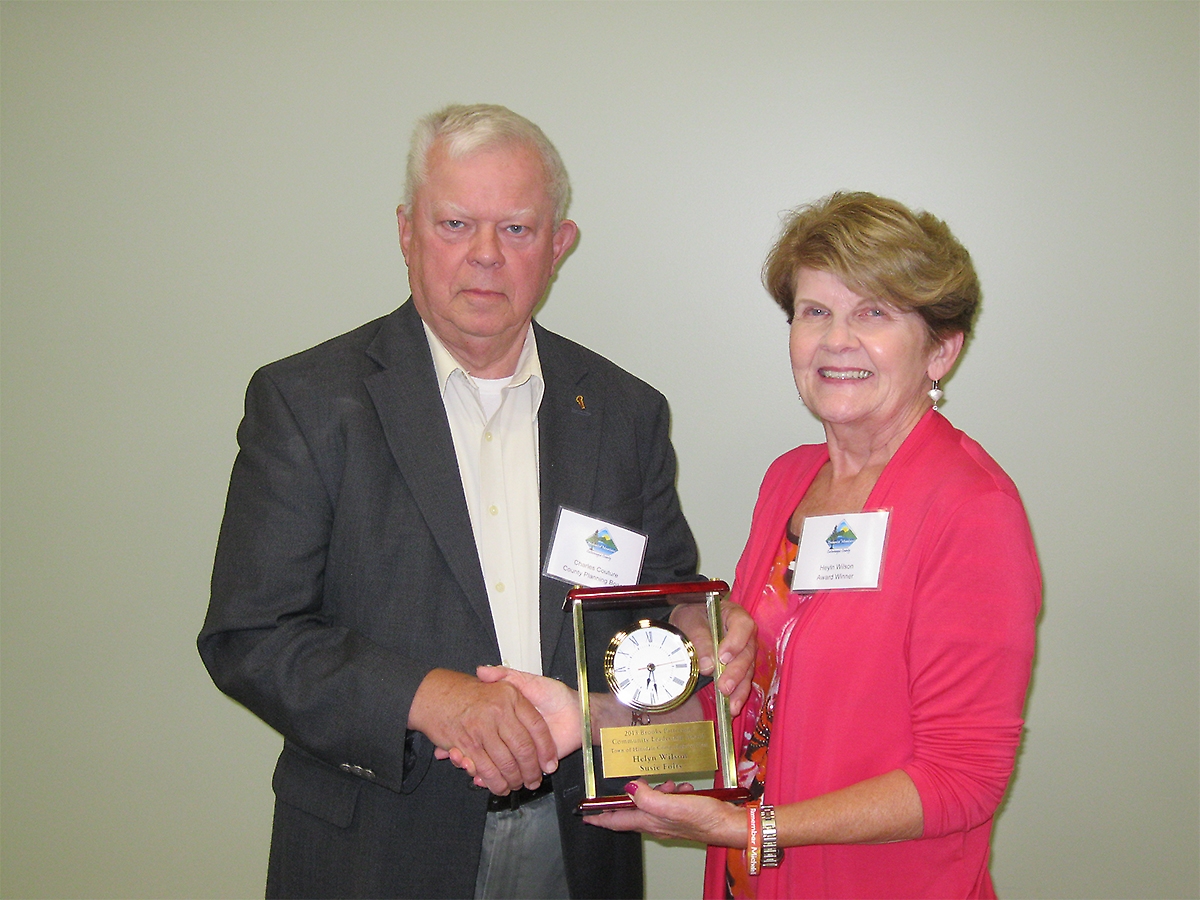 Helyn Wilson, co-winner of the Brooks Patterson Community Leadership Award, receives her award from Charles Couture, Chairman of the Cattaraugus County Planning Board. Missing from photo is the other co-winner, Susie Folts. Photo by CCEDP&T Chuck Couture and Helyn Wilson