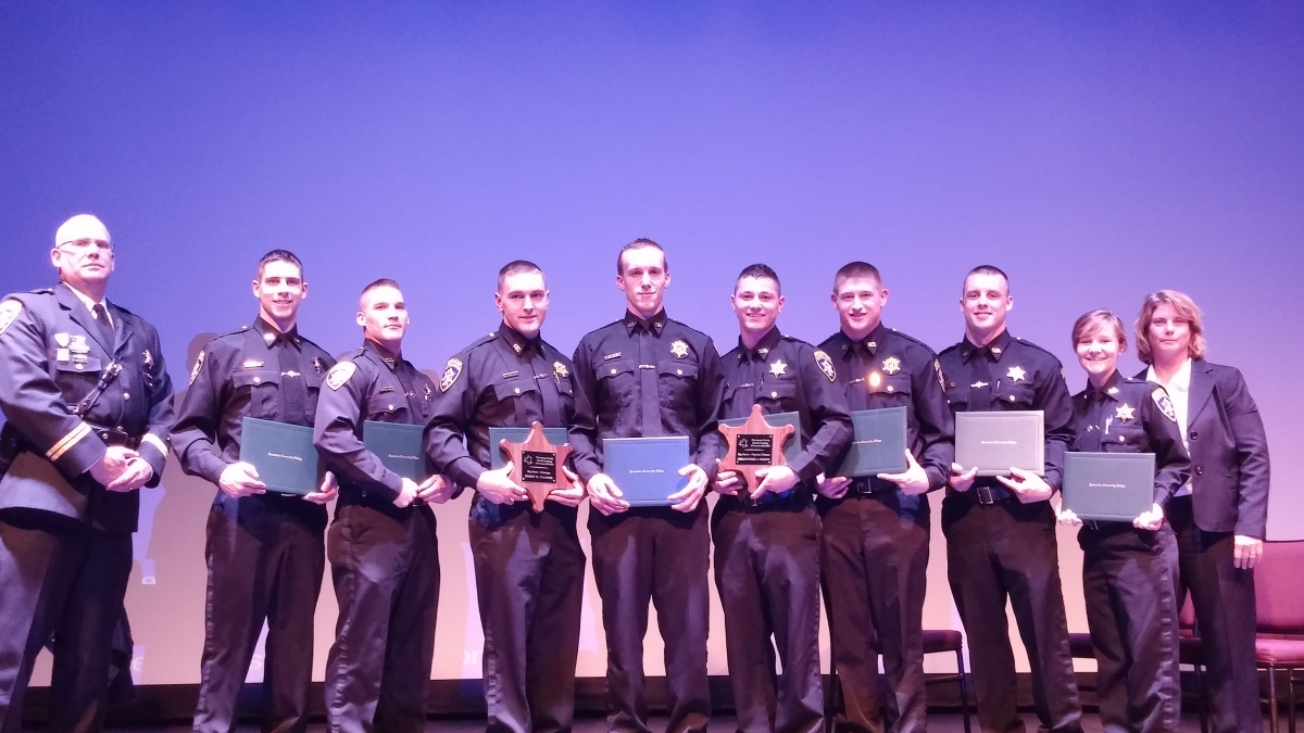 Left to Right: Lt. David Schuman, Andrew Grover, Kyle Baldwin, Brent Francis, Tyler Lewis, Christopher Draudt, William Hunt, Josh Bartholomew and Sydney Wheeler, Training Coordinator Christa Heckathorn 2015 Sheriff's Academy Graduates