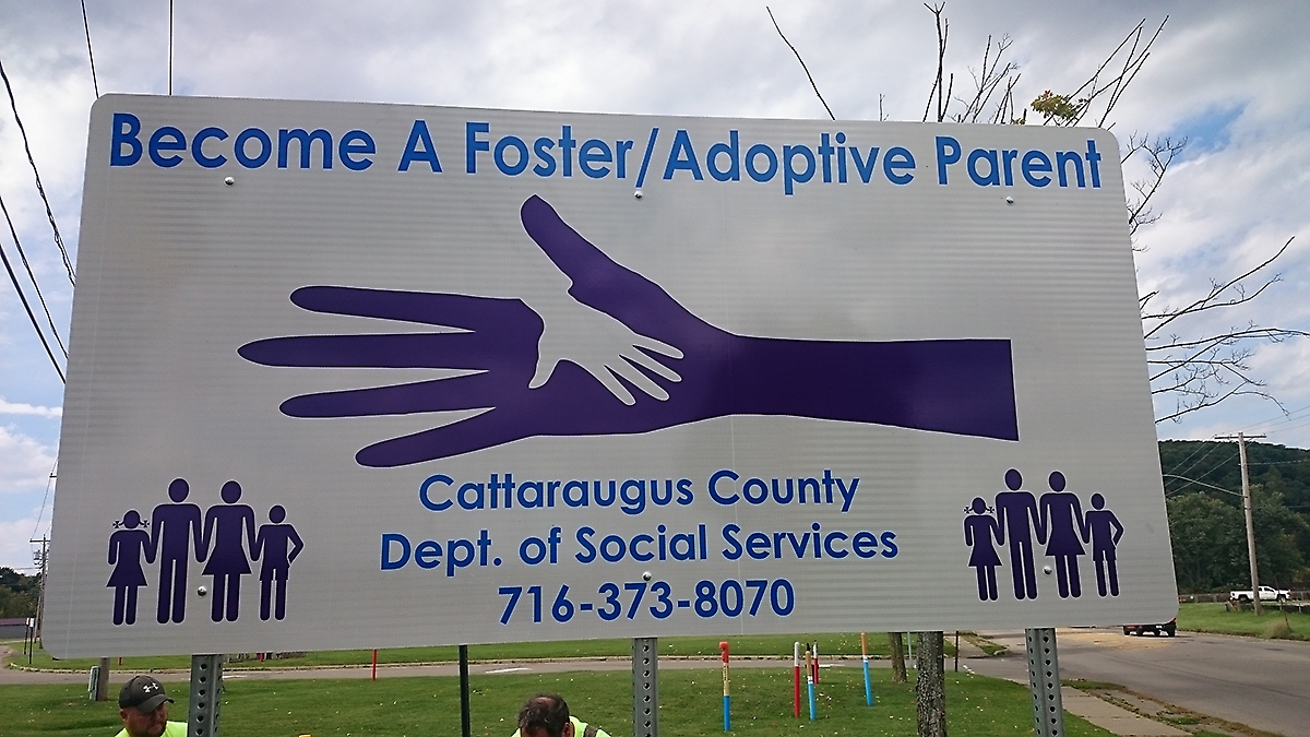 Sign promoting "Become a Foster/Adoptive Parent"