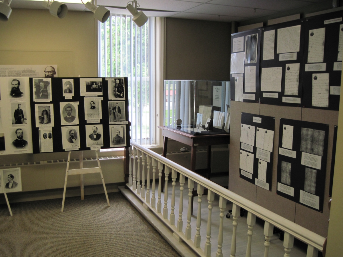 A display of photos and letters from Cattaraugus County