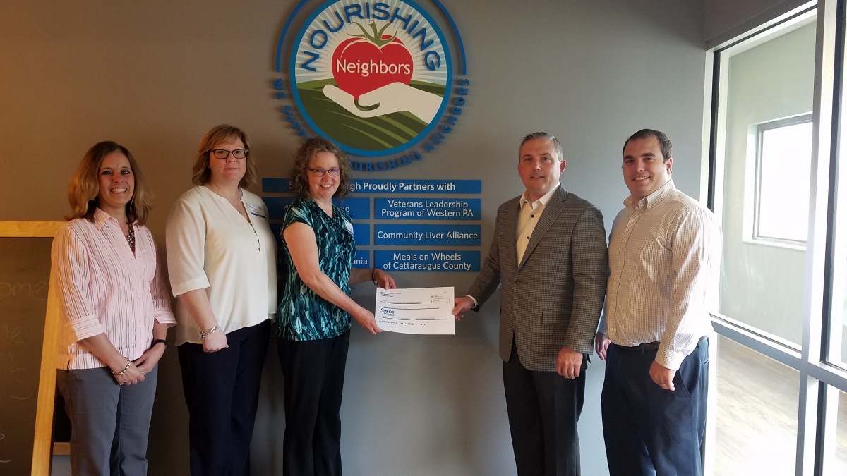 from left to right: Chris McBrien, HR Business Partner, Sysco Lisa Swaciak, Home Delivered Meal Coordinator, Department of the Aging Kim Connell, Nutrition Program Director, Department of the Aging Dan Willow, Contract Sales Lead, Sysco Bryan Mullen, VP of Finance, Sysco Donation presented from Sysco to Dept. of Aging