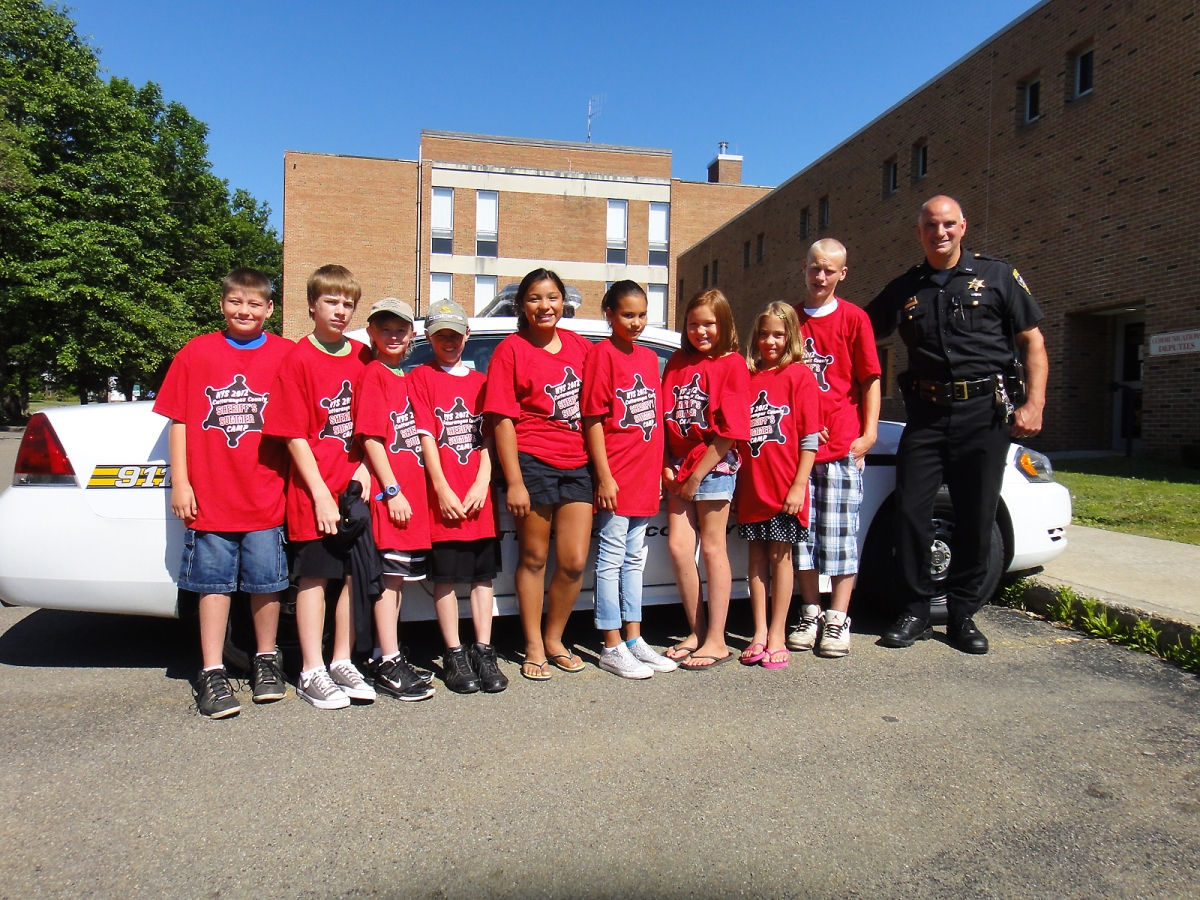 Standing with the campers are Lt. Shawn Gregory