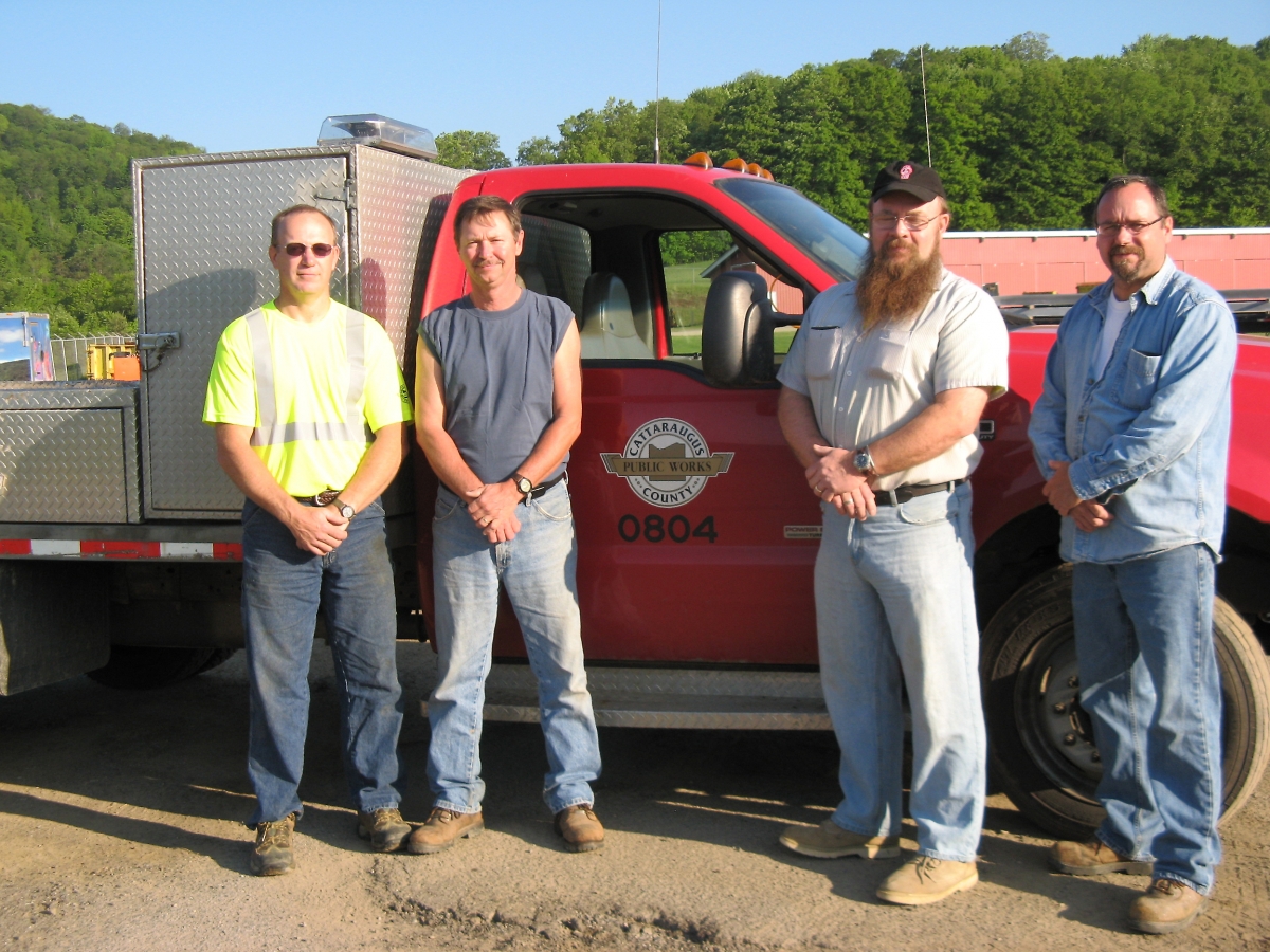 Sign Maintainers Sam Grey and Jim Frentz, Sign Technician Mark Loveless, and Sr. Traffic Sign Maintainer Bob Learn, work together to protect public health and safety. Cattaraugus County Sign Maintainers and Technicians