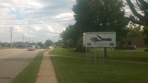 Fuzzy photo of new signs in Olean encouraging people to become foster parents