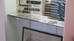 A lot of knives and photos of knife makers